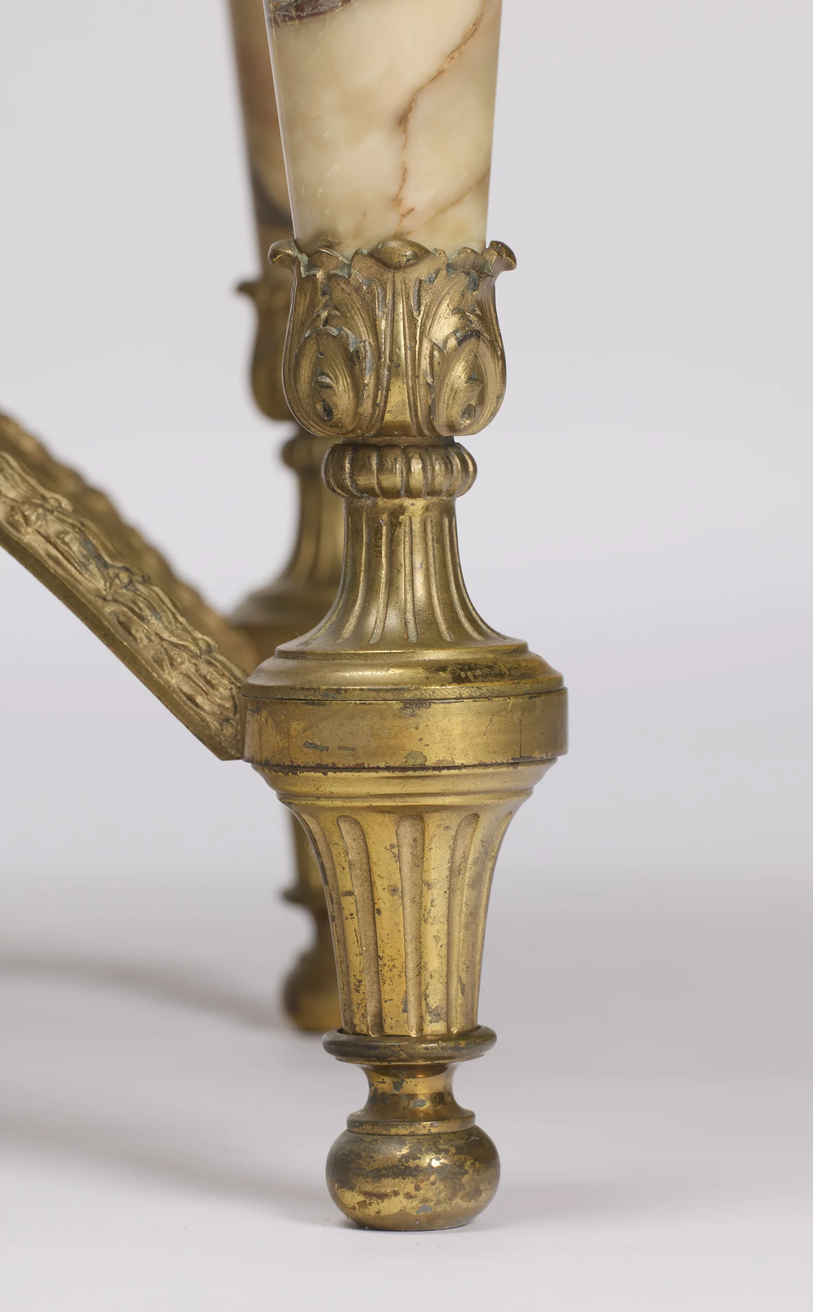Acanthus cup, gadrooned knop and fluted spade foot on a ball toe, the gilt rubbed and spotted.