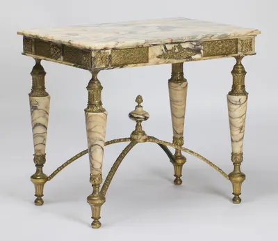 Long and short friezes mounted alike, the legs splaying to fluted gilt feet around the arched stretcher.