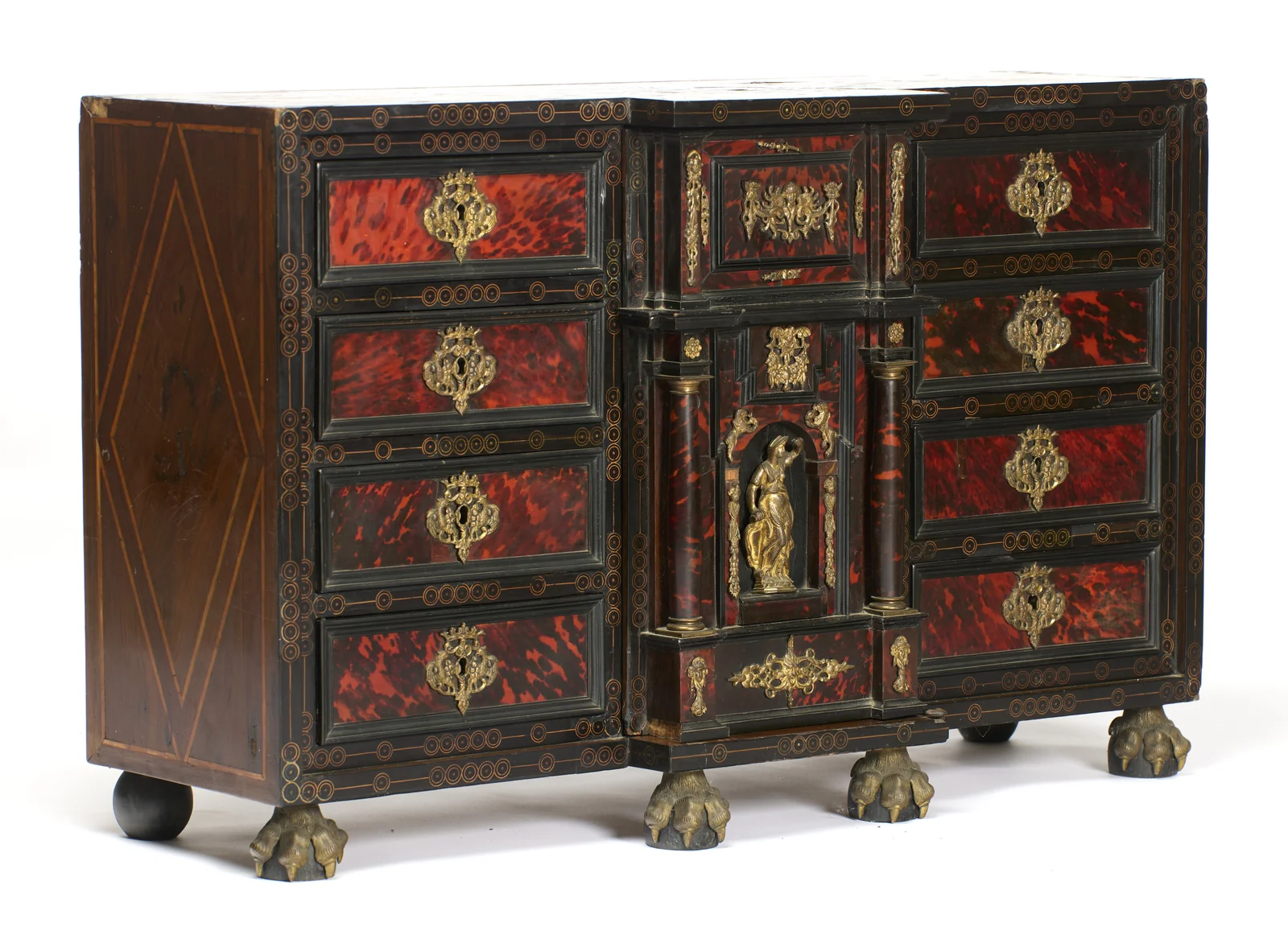 The left side carries a tall diamond of line inlay, meeting the circle-and-dot borders that frame every drawer on the front.