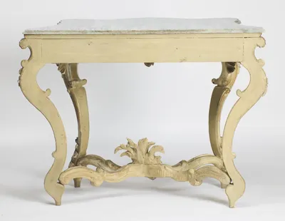 The plain painted back rail and flat-backed rear legs, with the marble overhanging and the stretcher plume seen from behind.