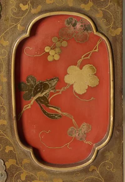 A squirrel climbing a fruiting vine with berries and broad leaves, set in a gilt-edged red reserve amid scrolling vines.