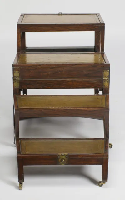 Each tread carries a tooled leather inset within its wooden border; a brass catch plate fastens the lowest riser.