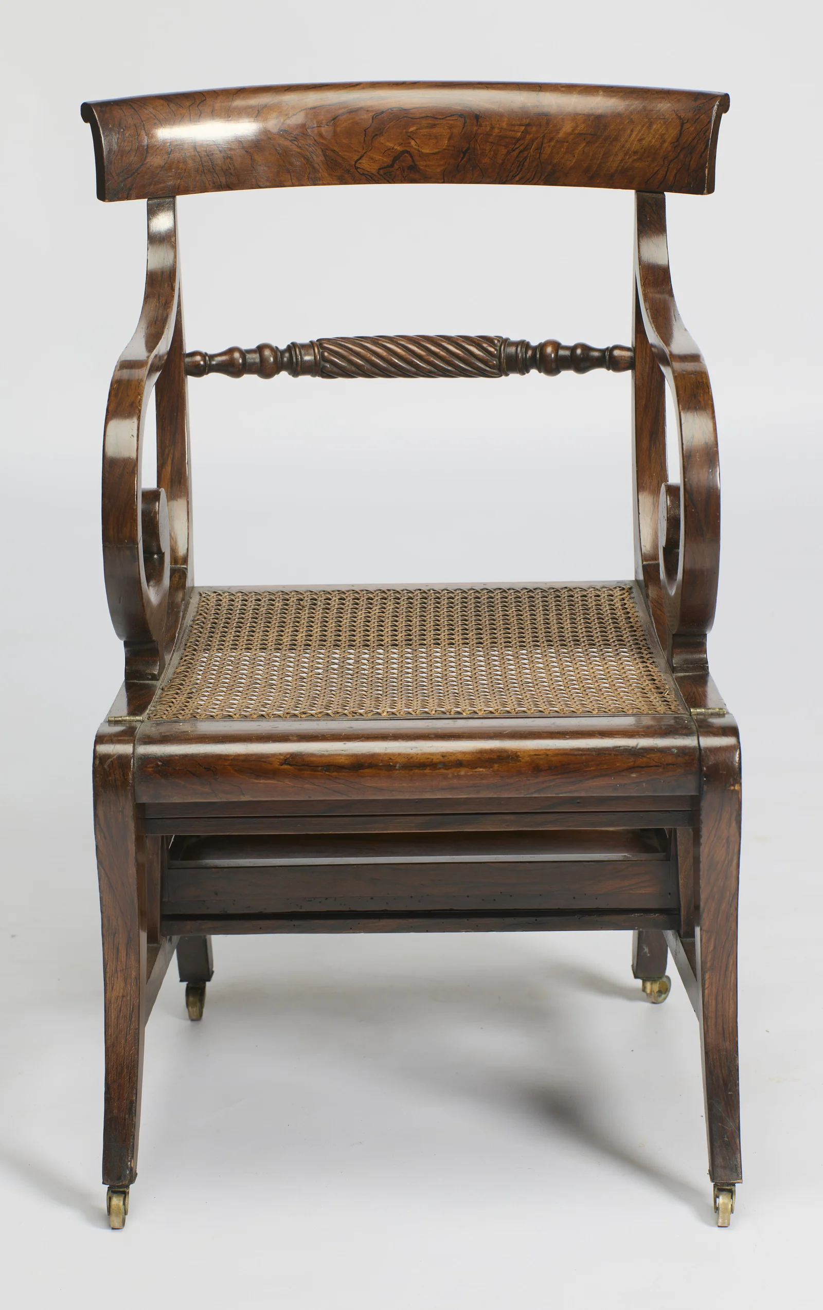 With the squab removed the cane panel fills the seat frame, small brass hinges showing at either end of the seat rail.