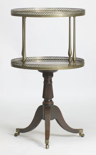The stand seen straight on, showing the spacing of the two galleried tiers and the spread of the tripod base.