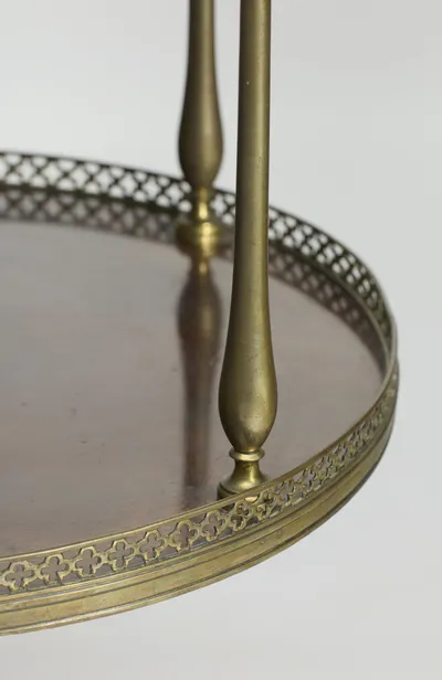 Elongated teardrop supports rising from turned collars through the gallery edge, with light scratches and rubbing to the metal.