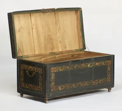 The lid raised on its two retaining chains, the interior and lid underside of plain pale timber, the inner frame of the lid painted green.