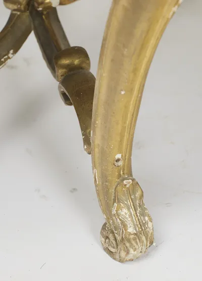 The scrolled toe is carved with acanthus, and rubbing through to the white ground is plain on the high points.
