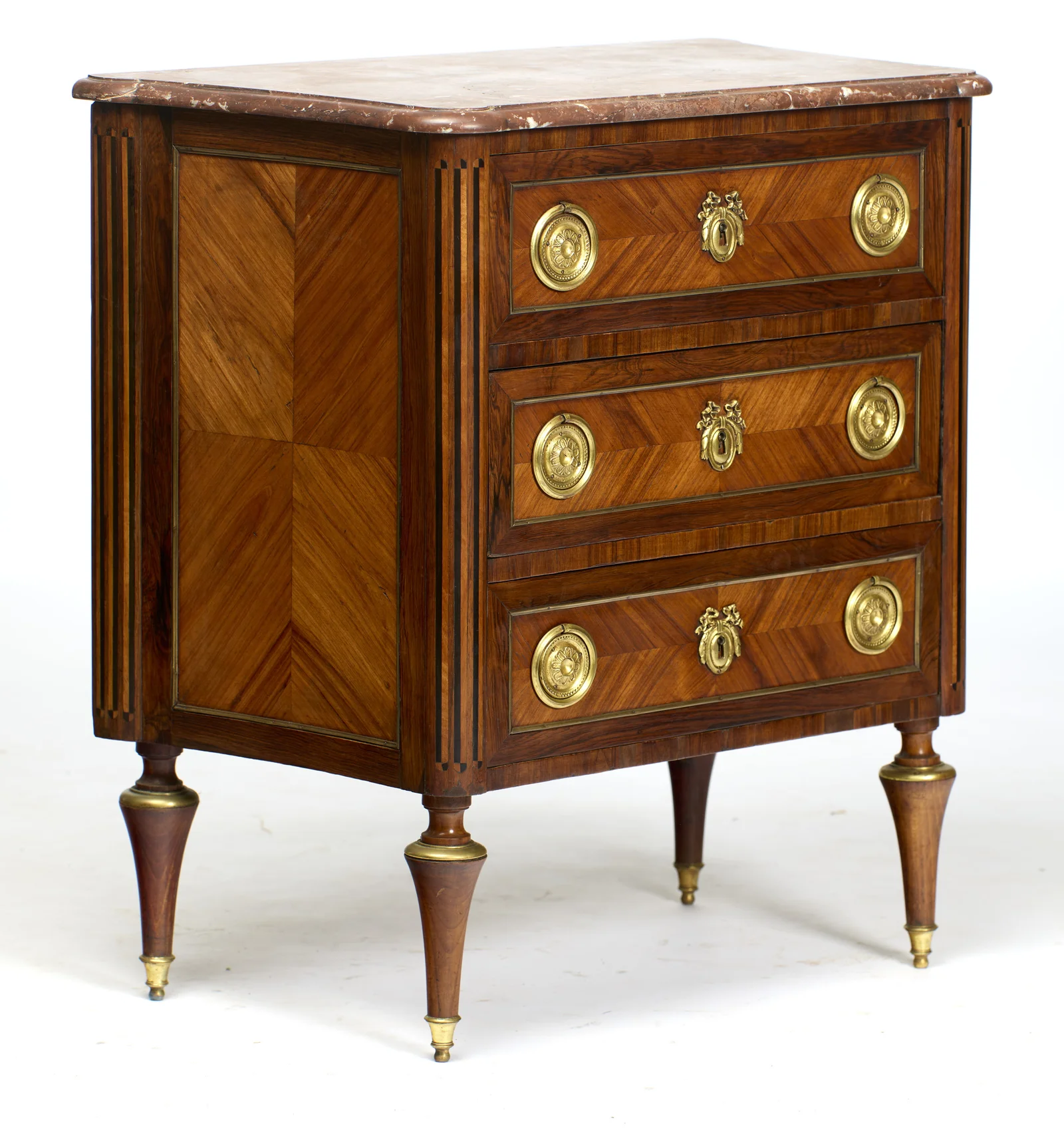 The quartered side panel sits within a fine gilt-metal border, the inlaid corner flutes running the full height between top and legs.