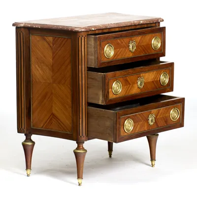 All three drawers shown open, with pale timber linings and deep boxes behind the veneered and gilt-metal-framed fronts.