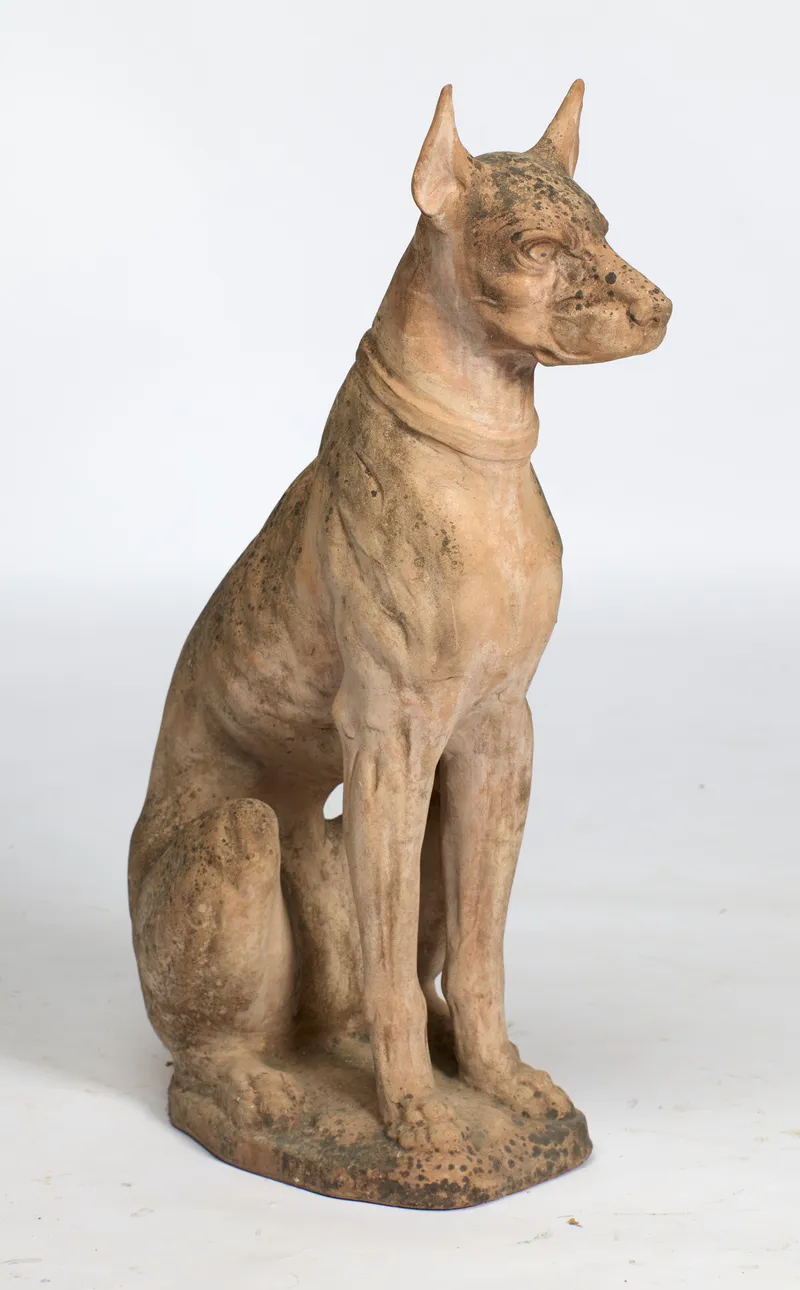 A large weathered terracotta model of a seated dog, impressed PESCI GIORGIO IMPRUNETA