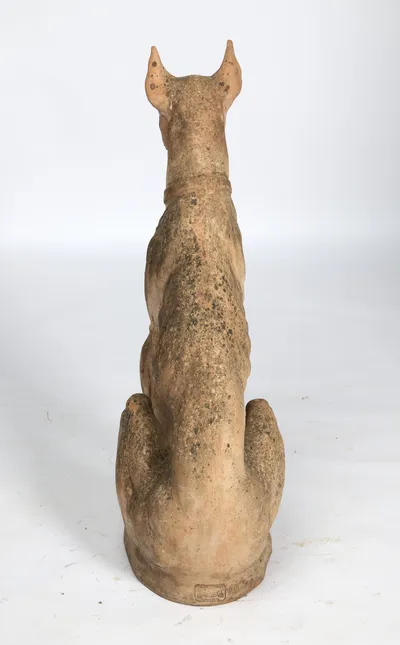 The back tapers to the loin between the haunches, with the impressed cartouche sitting low on the base.