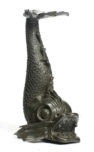 The body rises in a tight S-curve from the gaping head, the thin-edged leaf tilting out over the upturned tail.